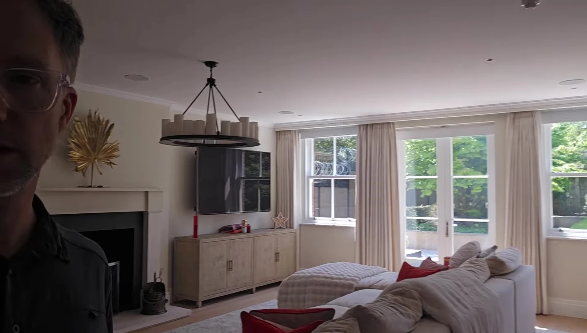 Living room with motorized TV bracket.