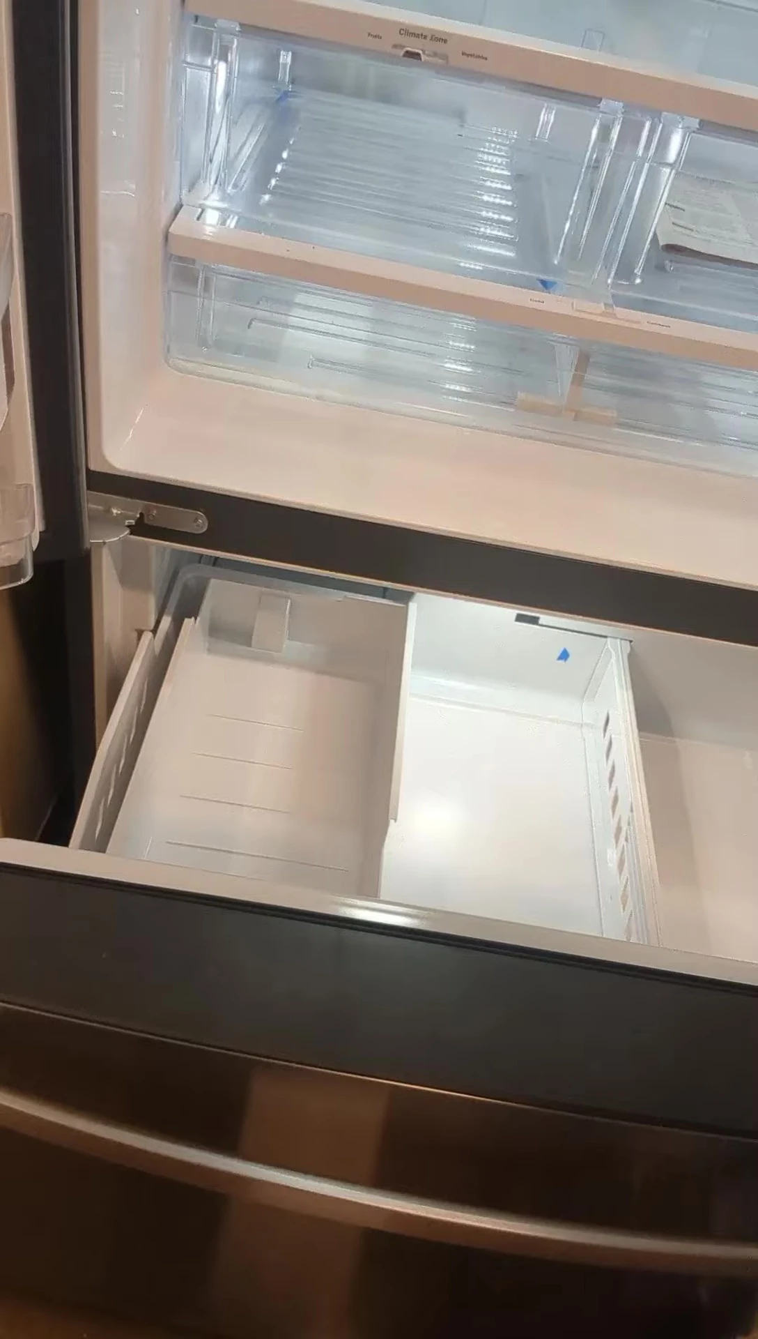 View of the interior lighting showcasing the fridge's contents.
