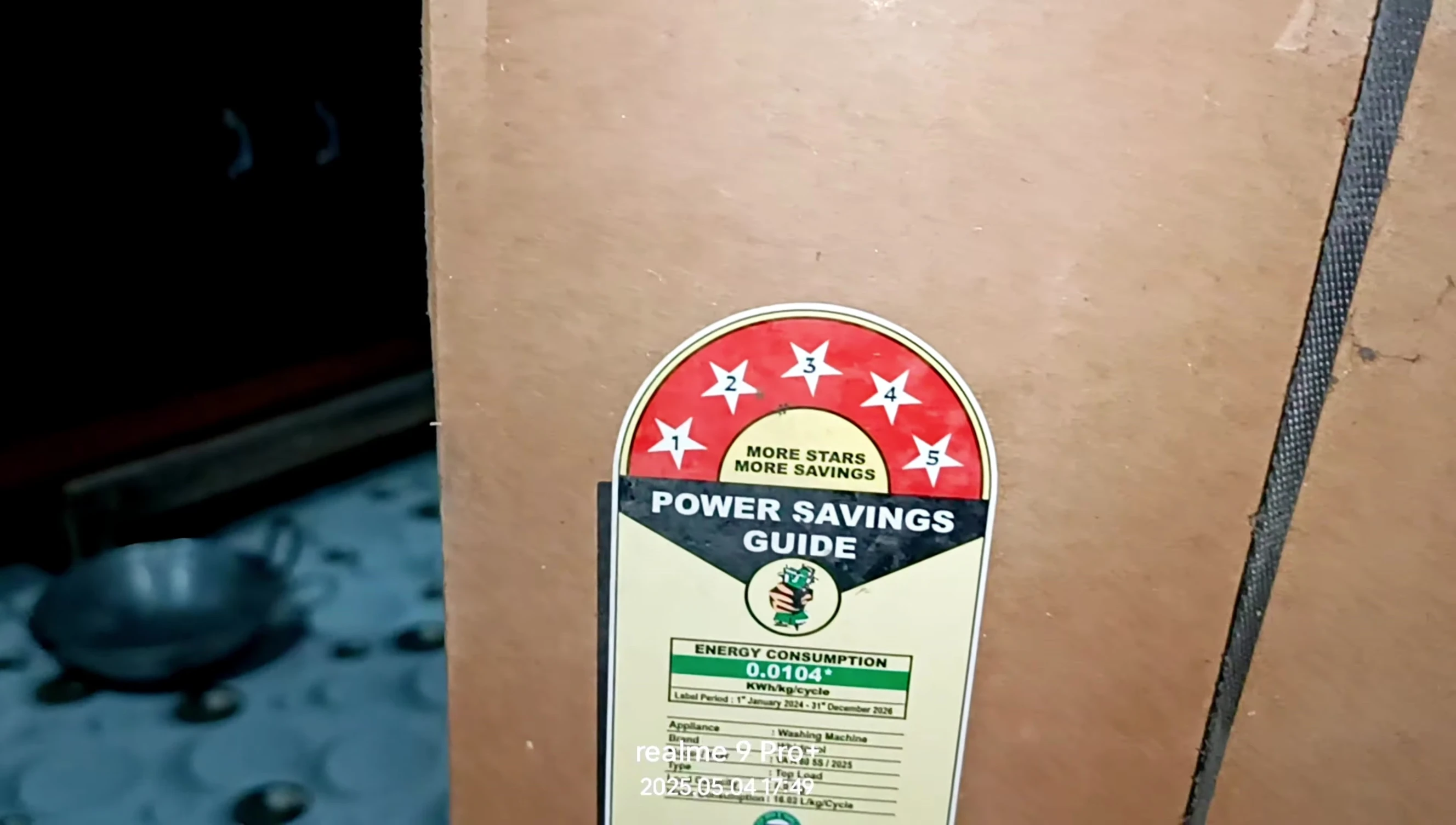 Close-up of the washing machine's label indicating it's a 5-star, 8kg model.