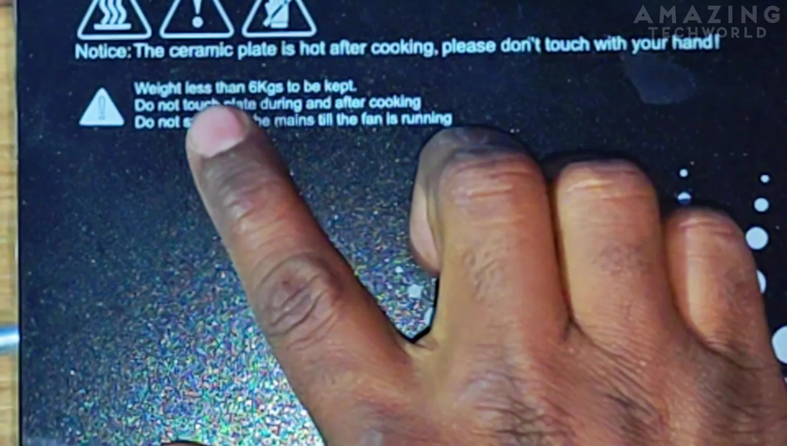 Cooktop warning label about weight limits