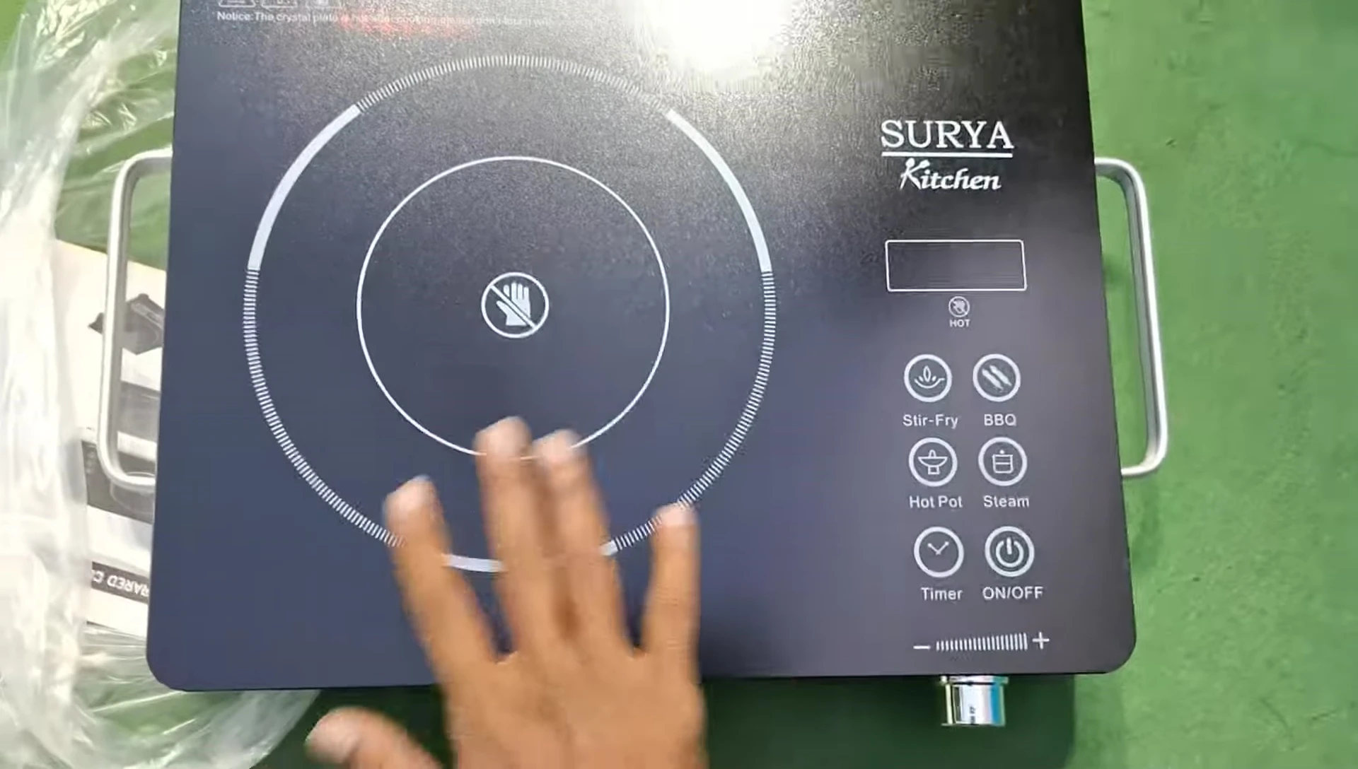 The front panel of the Surya infrared cooktop with its touch controls.
