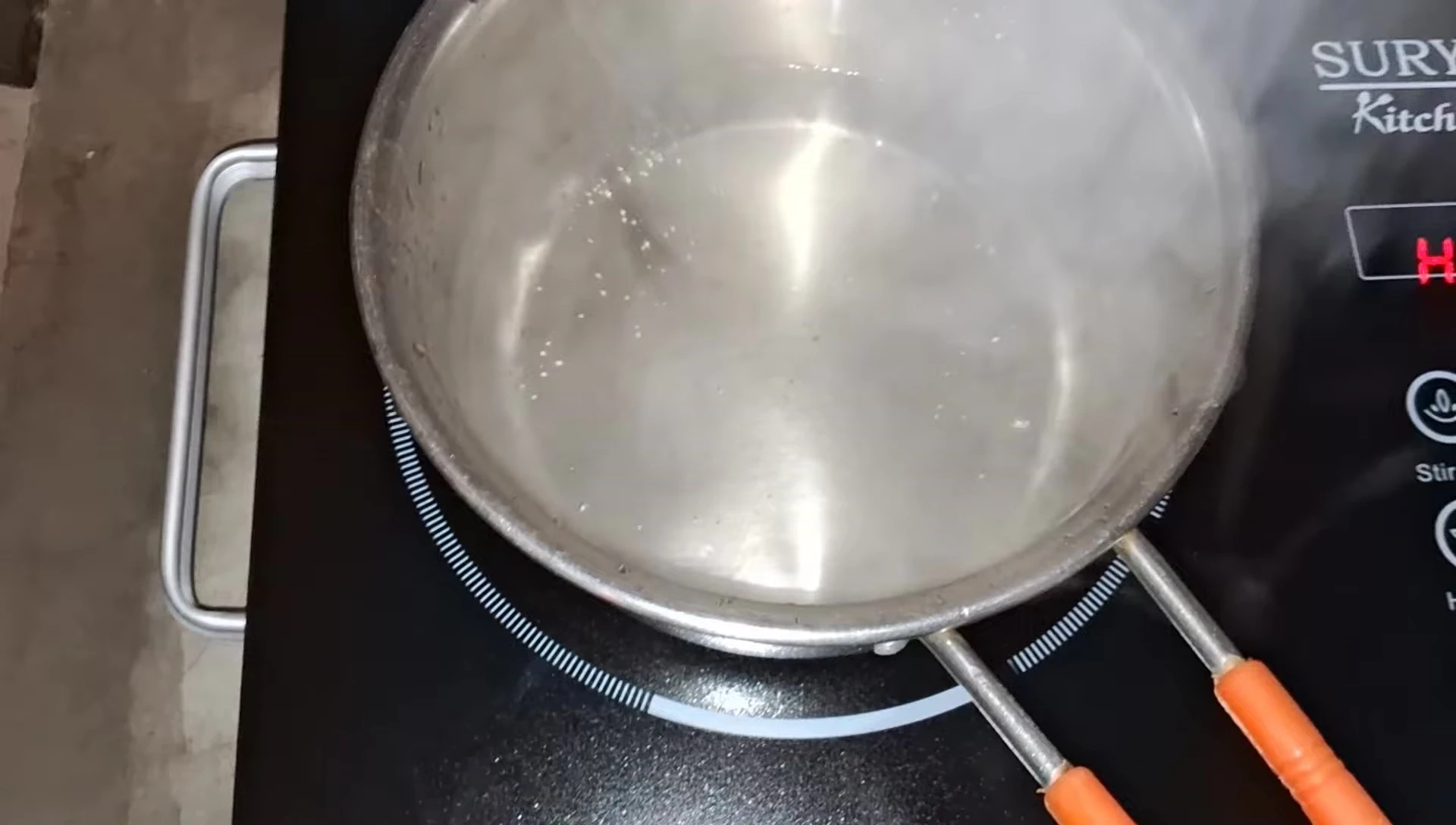 Boiled water in a utensil on the cooktop