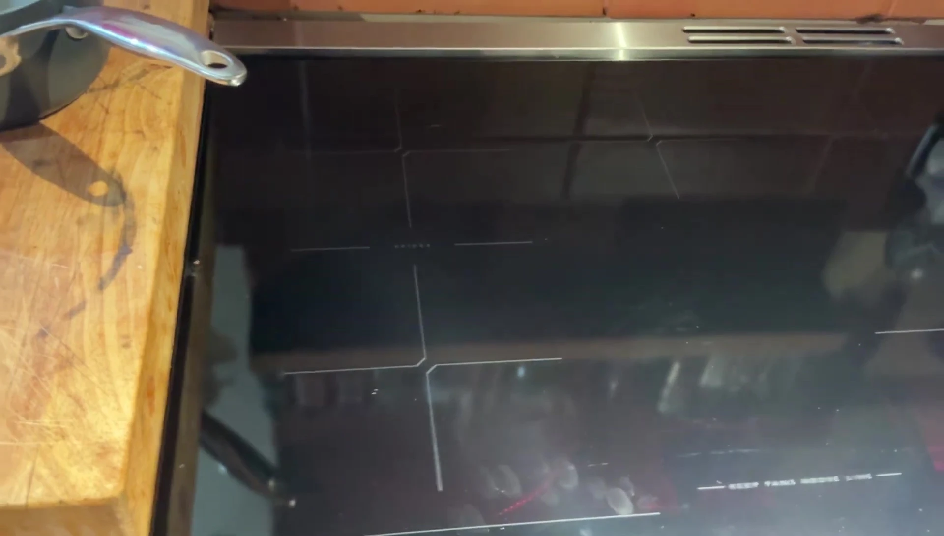 Demonstration of how easy it is to clean the Frigidaire induction cooktop.