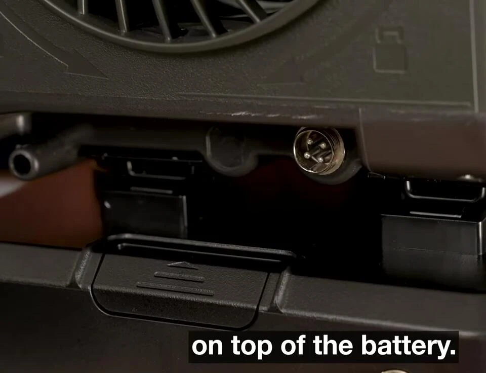 Pressing the battery and AC unit together