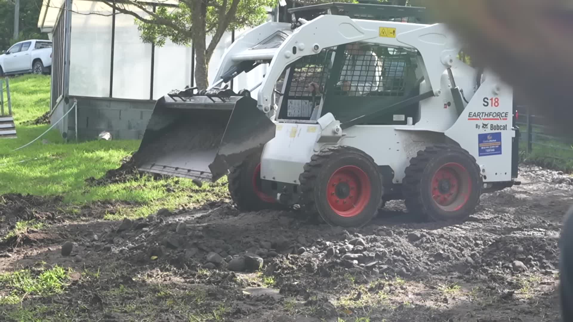 Skid steer working on the mountain road