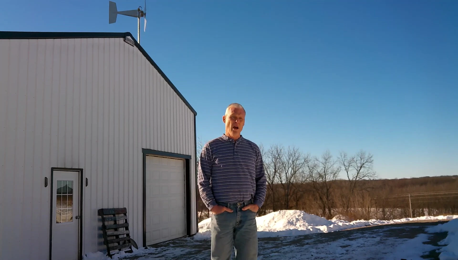 A shot of the wind turbine, emphasizing its small size.