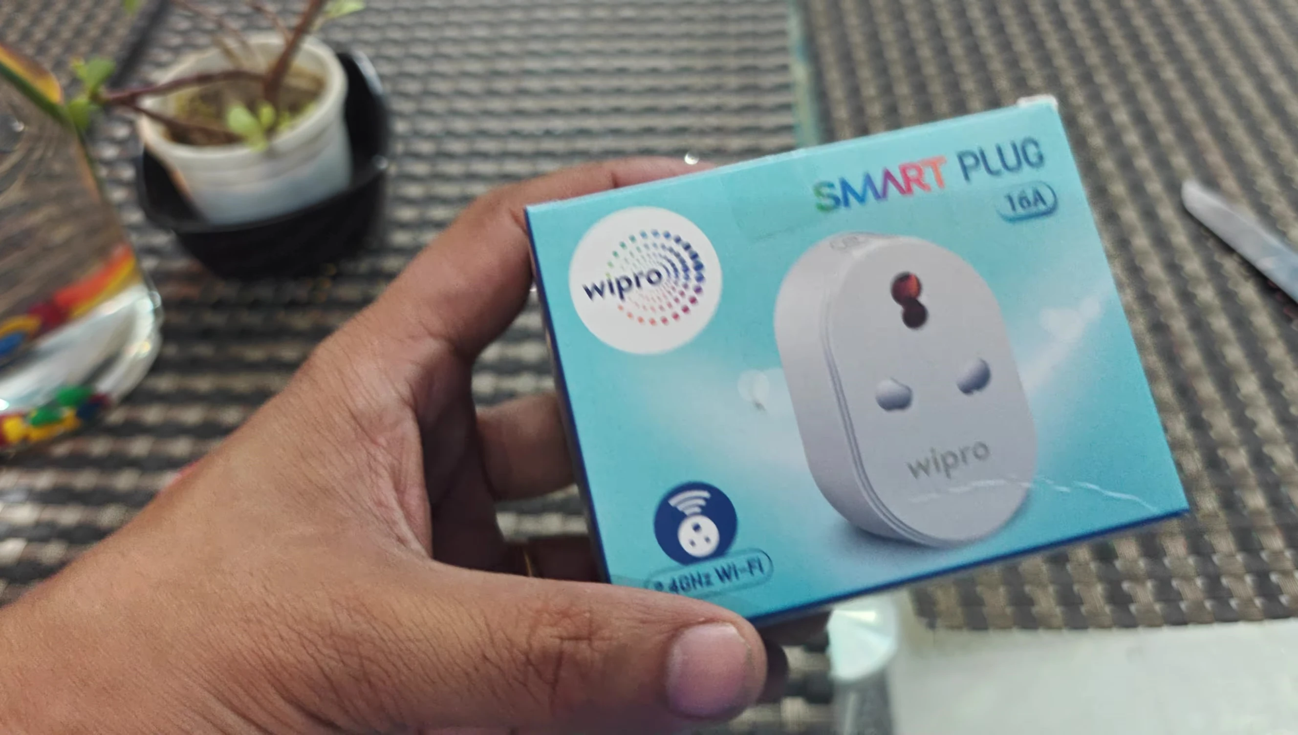 Close-up view of the Wipro 16A Smart Plug removed from its packaging.