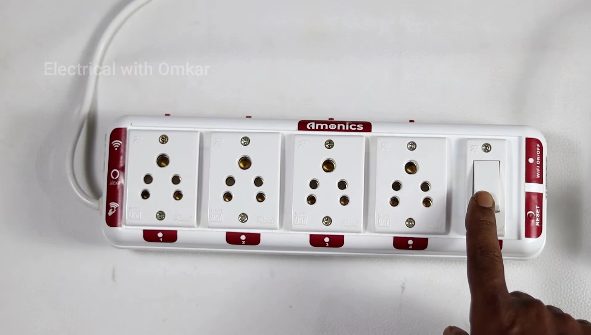 Turning on the smart extension board with the power switch.