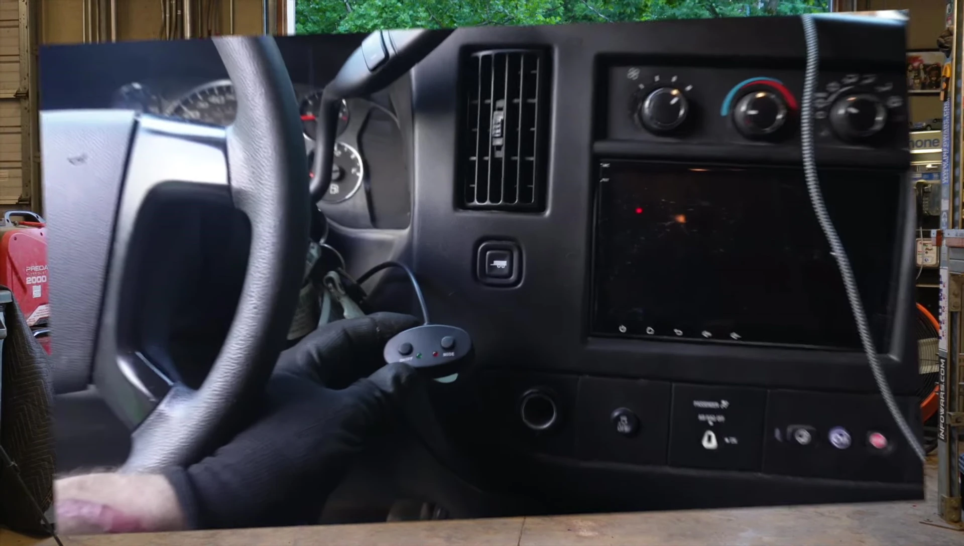 Routing the control cable into the dashboard.