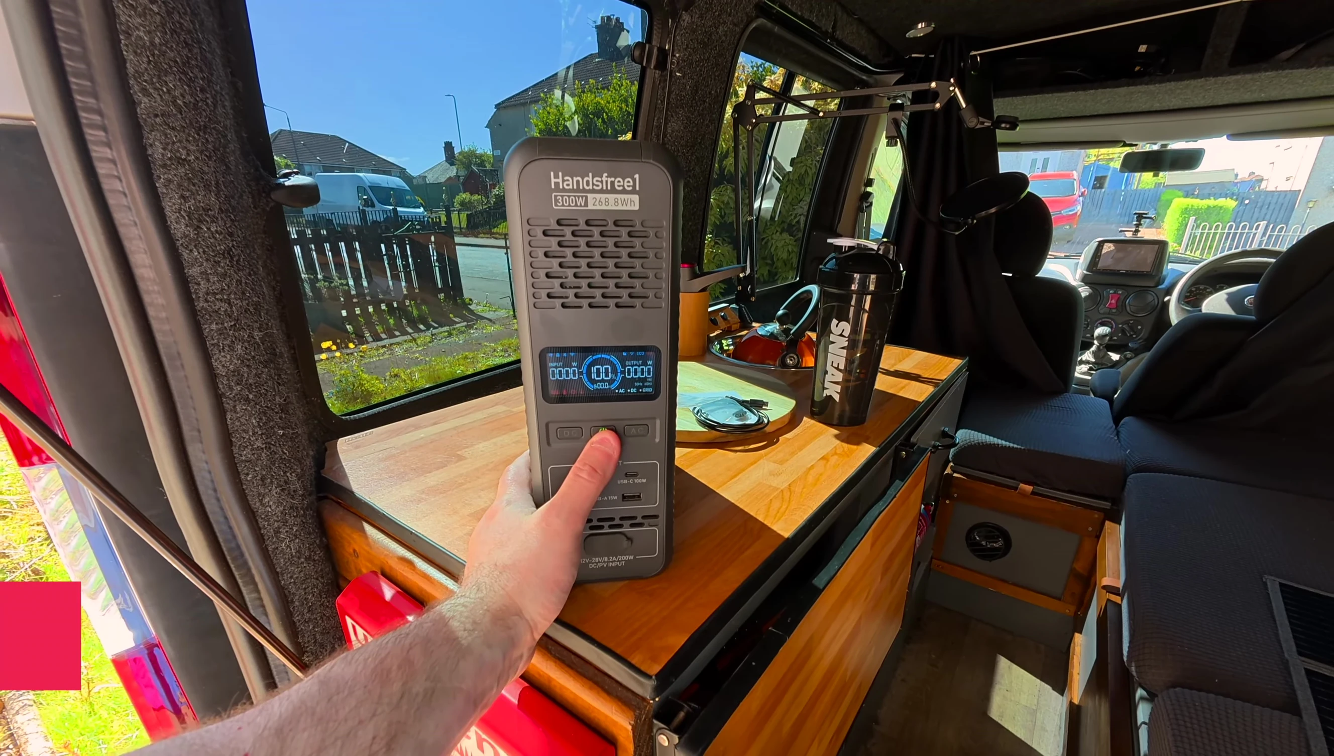 The solar panel connected to a power bank and backpack, demonstrating its use.