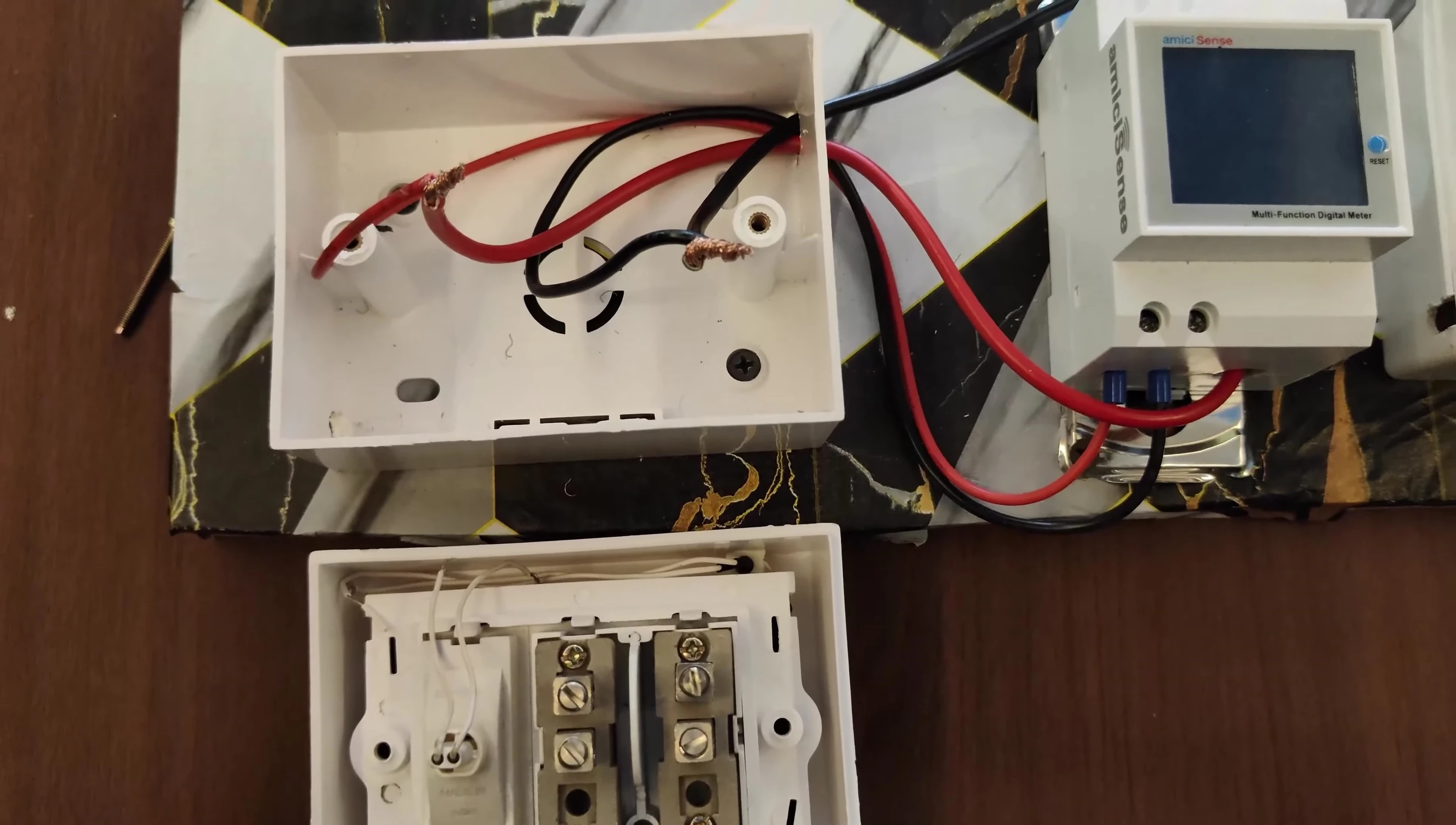 Demonstration of connecting wires to the meter's terminal.