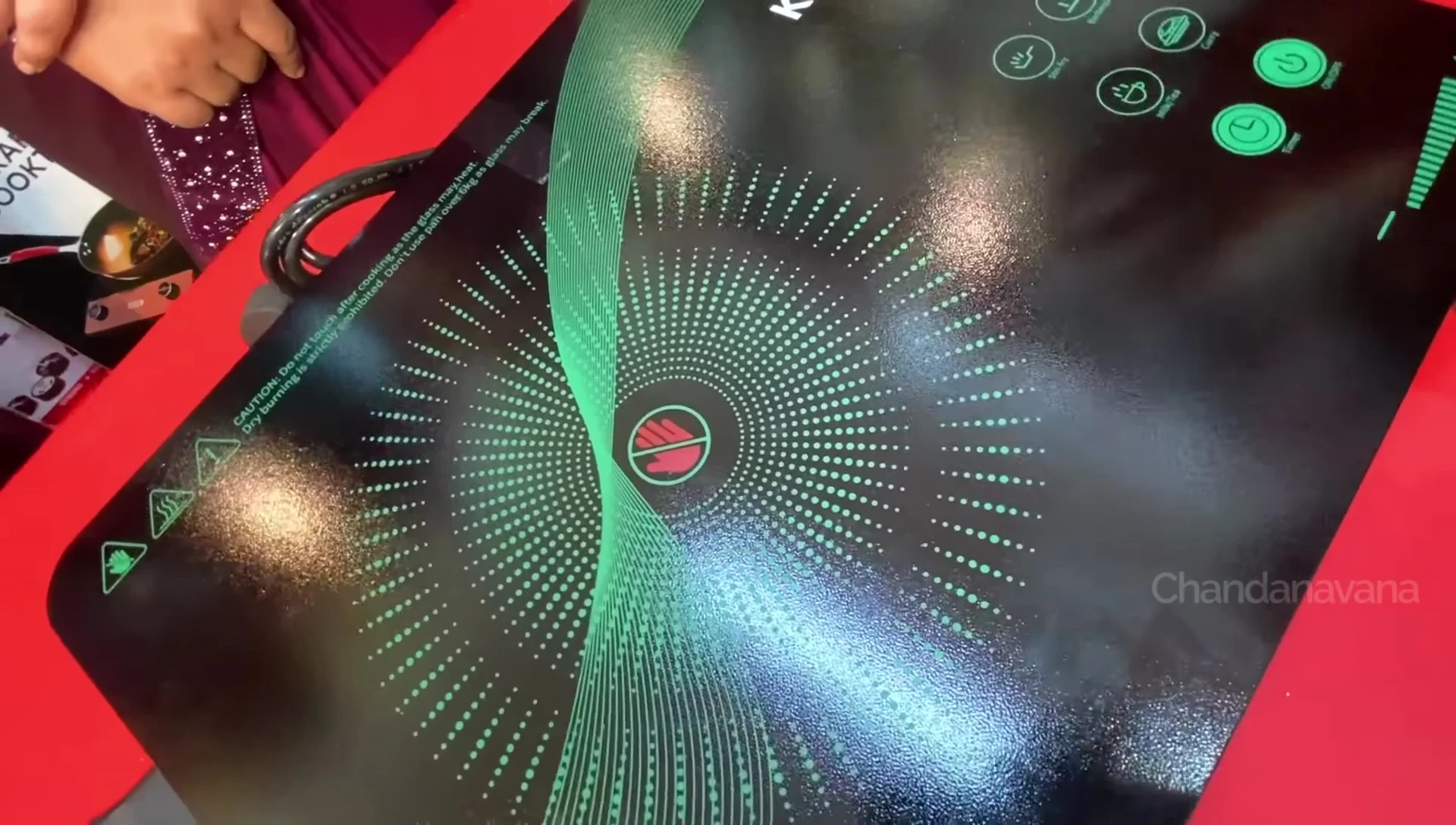 Close-up shot of the cooktop's LED display and touch buttons