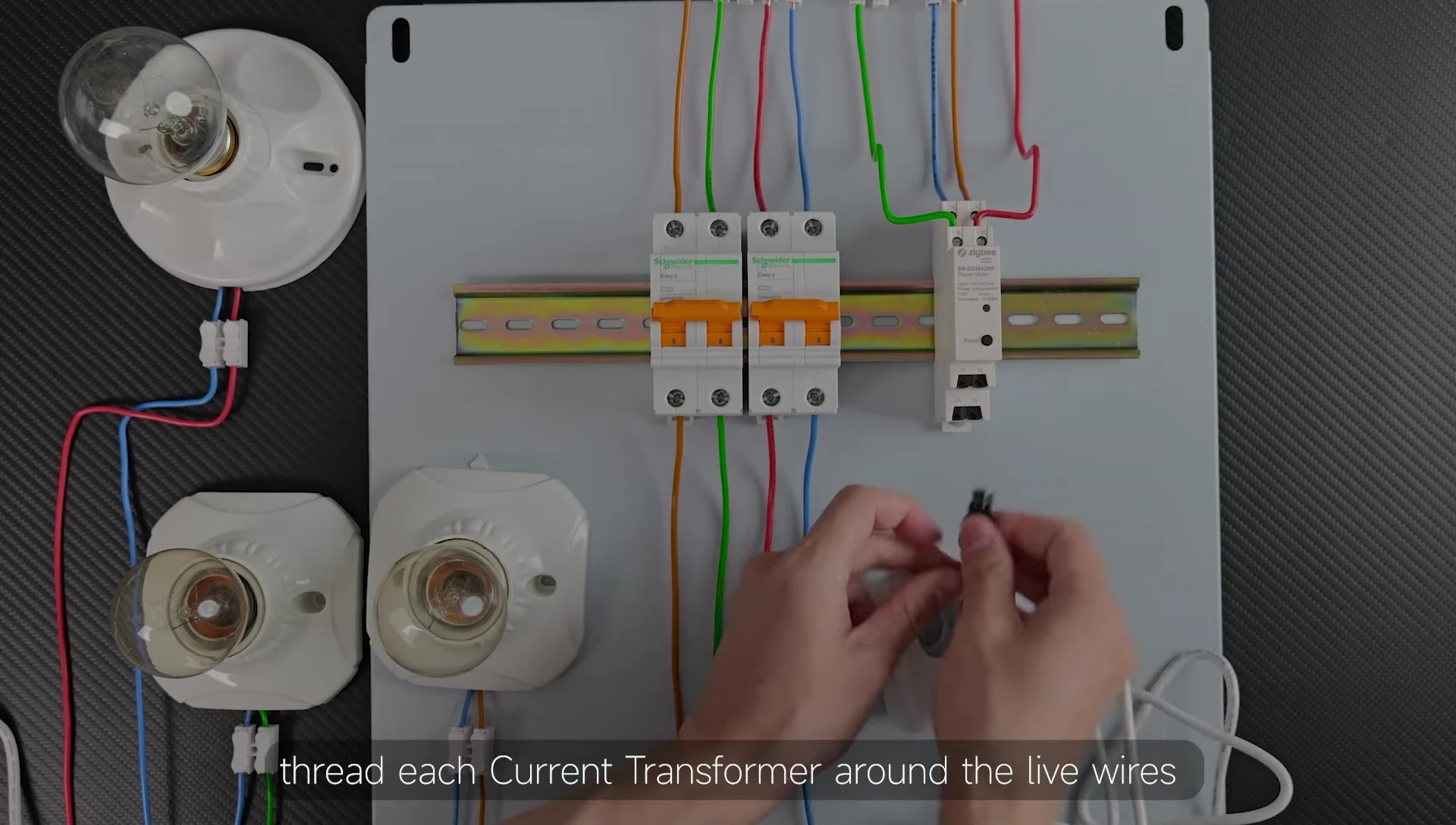 Detailed shot of connecting current transformers in three-phase setup.