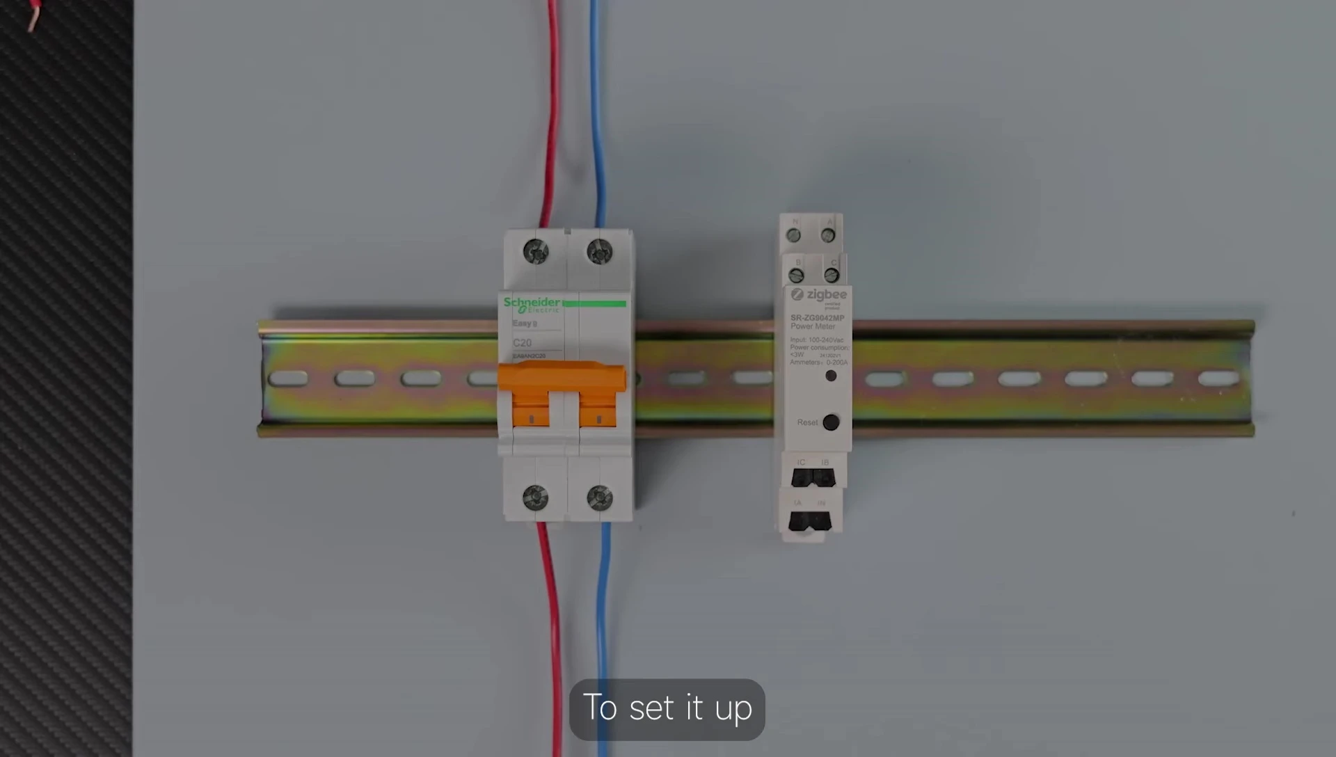 Person connecting wires to the energy meter.