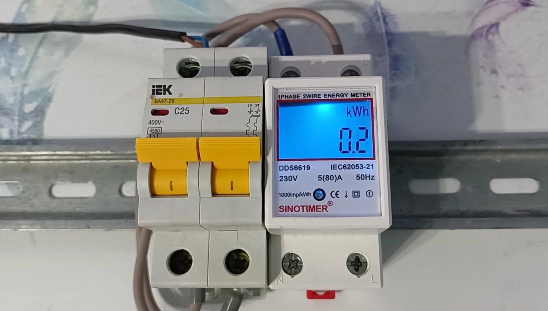 The meter being installed on a standard DIN rail.