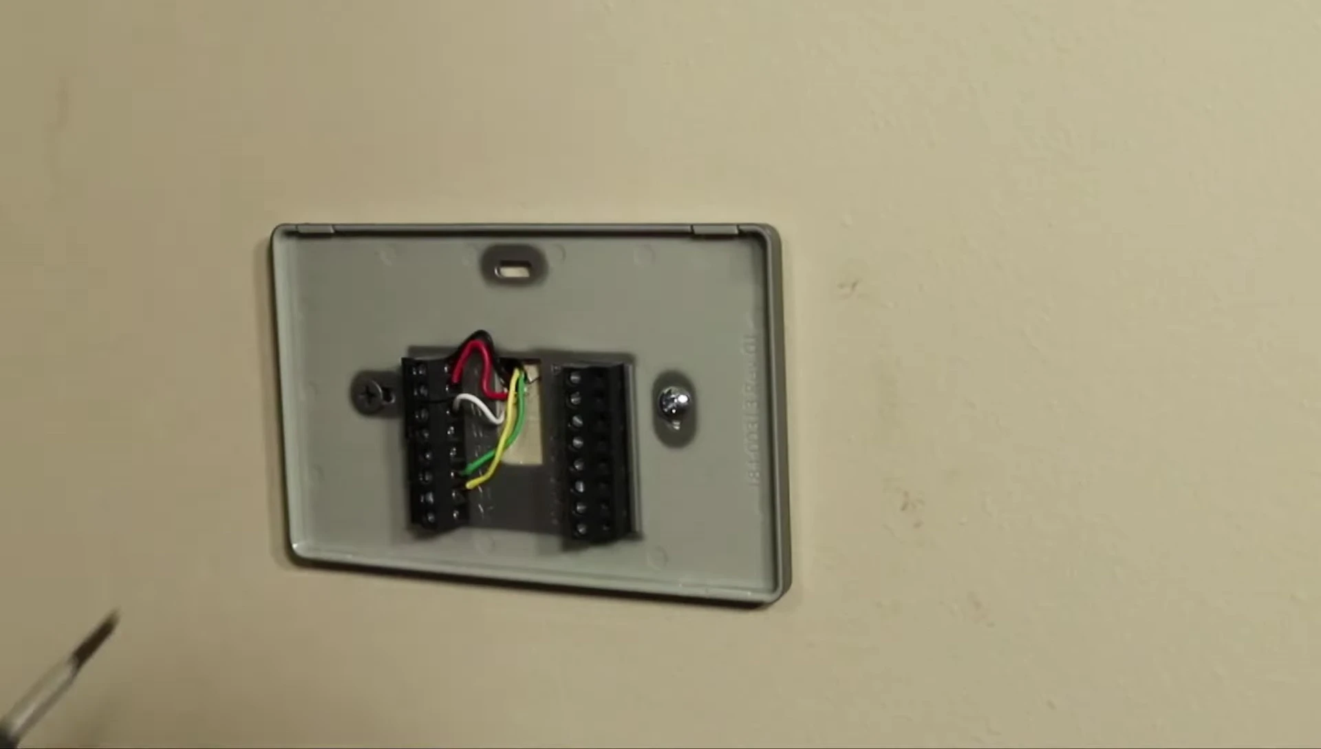 Removing the old thermostat faceplate