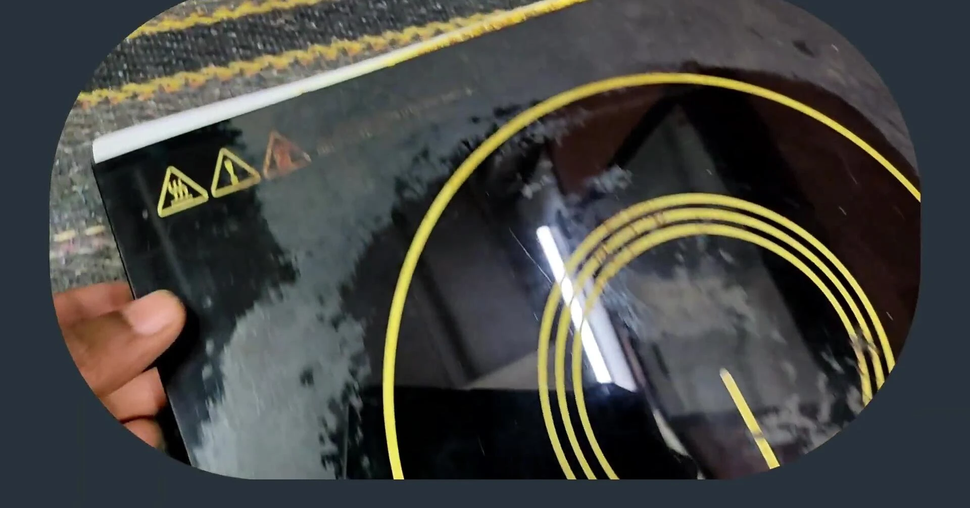 A shot of the induction cooktop showing minor damage to the frame.
