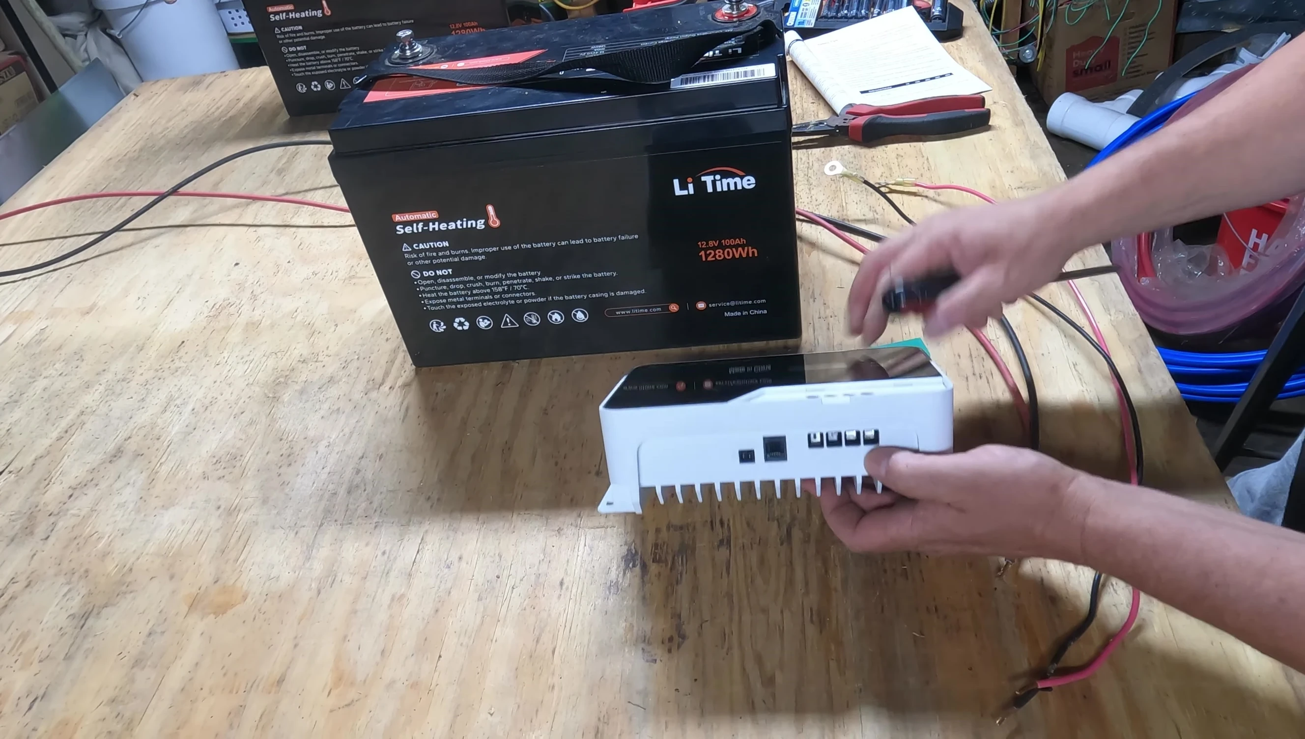 Demonstration of connecting wires to the charge controller terminals