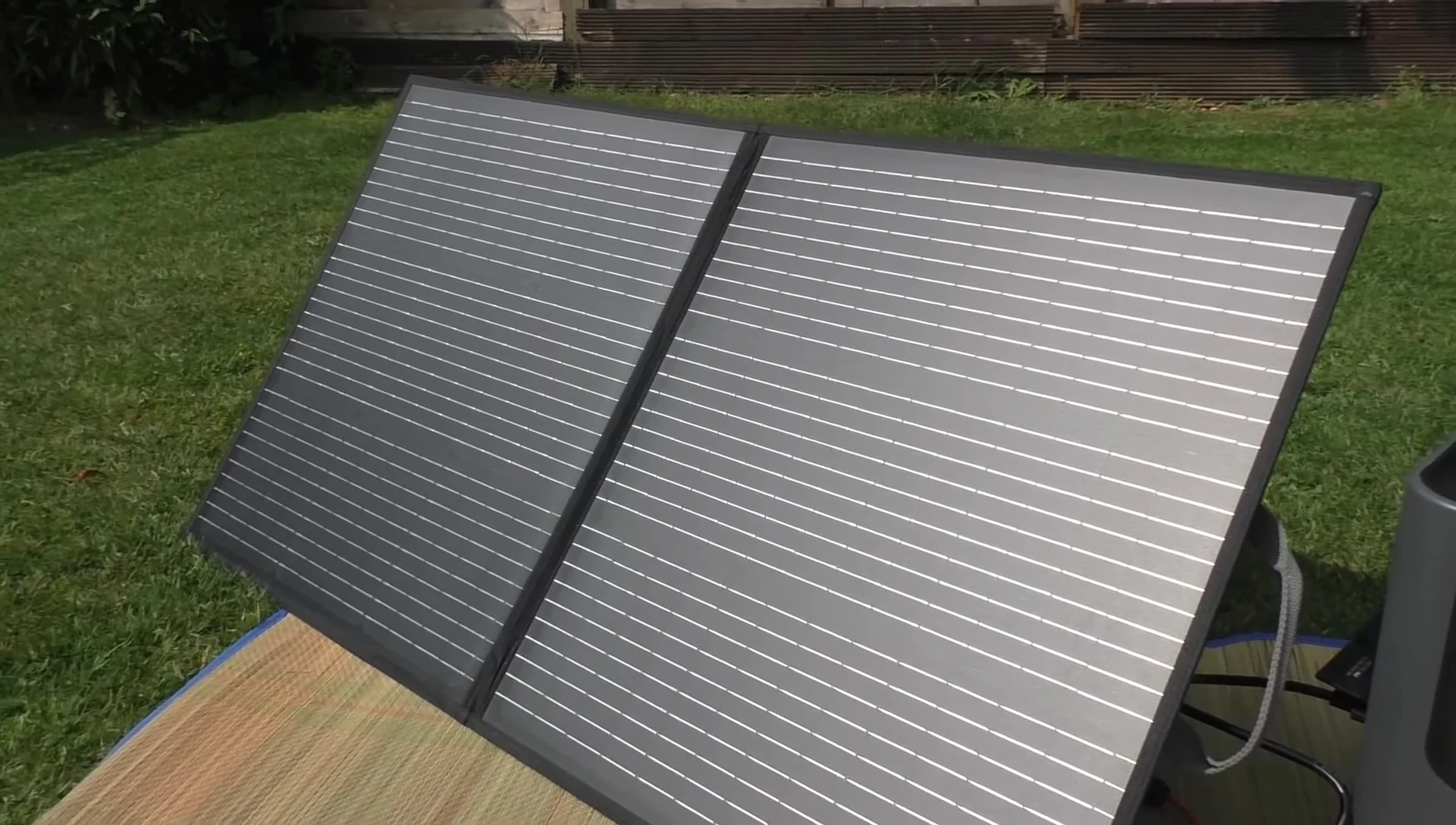 The solar panel charging a power bank in hazy sunlight