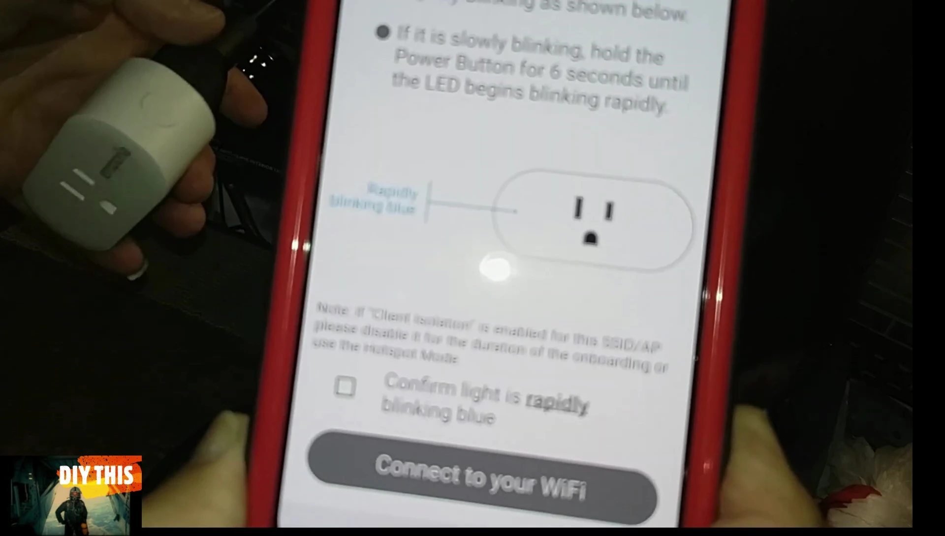 Close-up of the smart plug with the indicator light flashing rapidly.