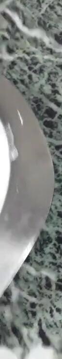 The visual indicator (wave symbol) showing when an item is on the cooktop.