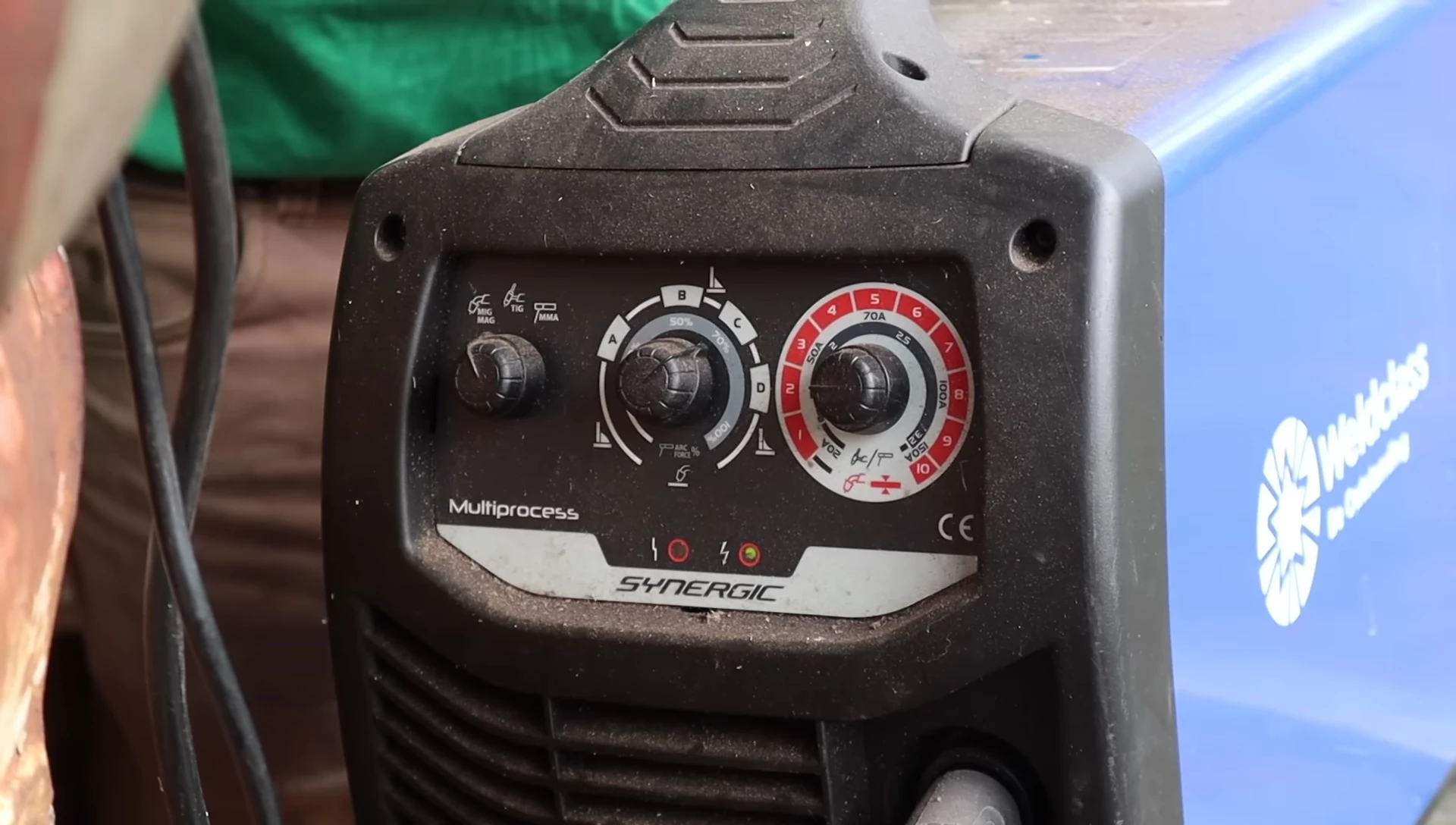 The reviewer using a MIG welder with the power station.