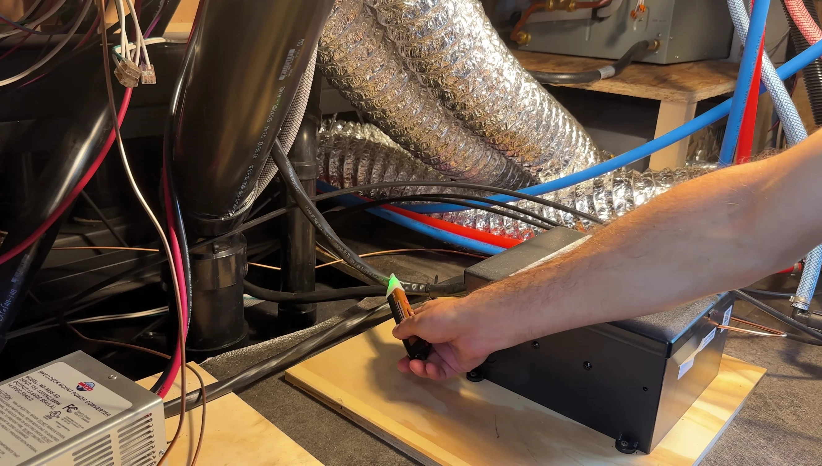 The voltage tester is used to verify the absence of voltage in the wires.