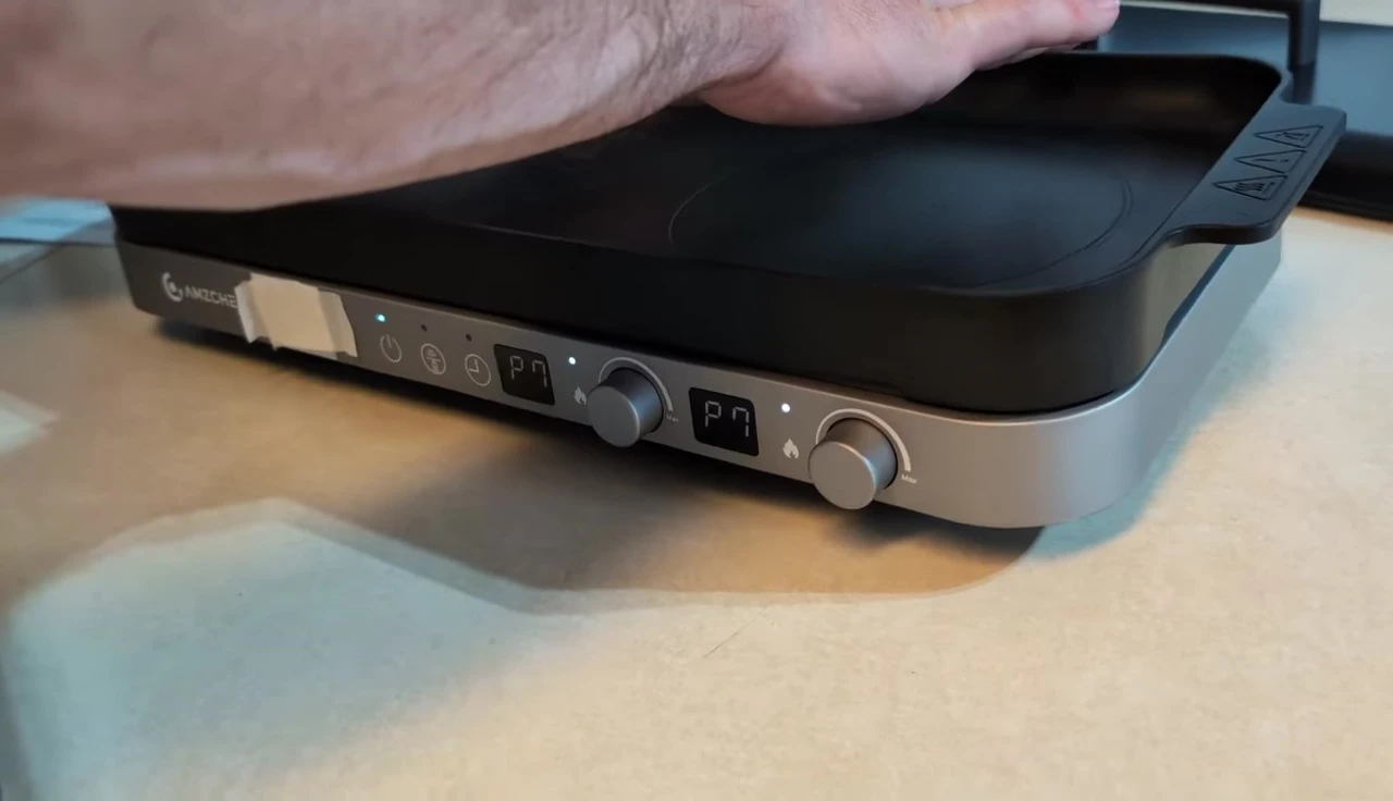Cooktop heating up with cookware placed on it