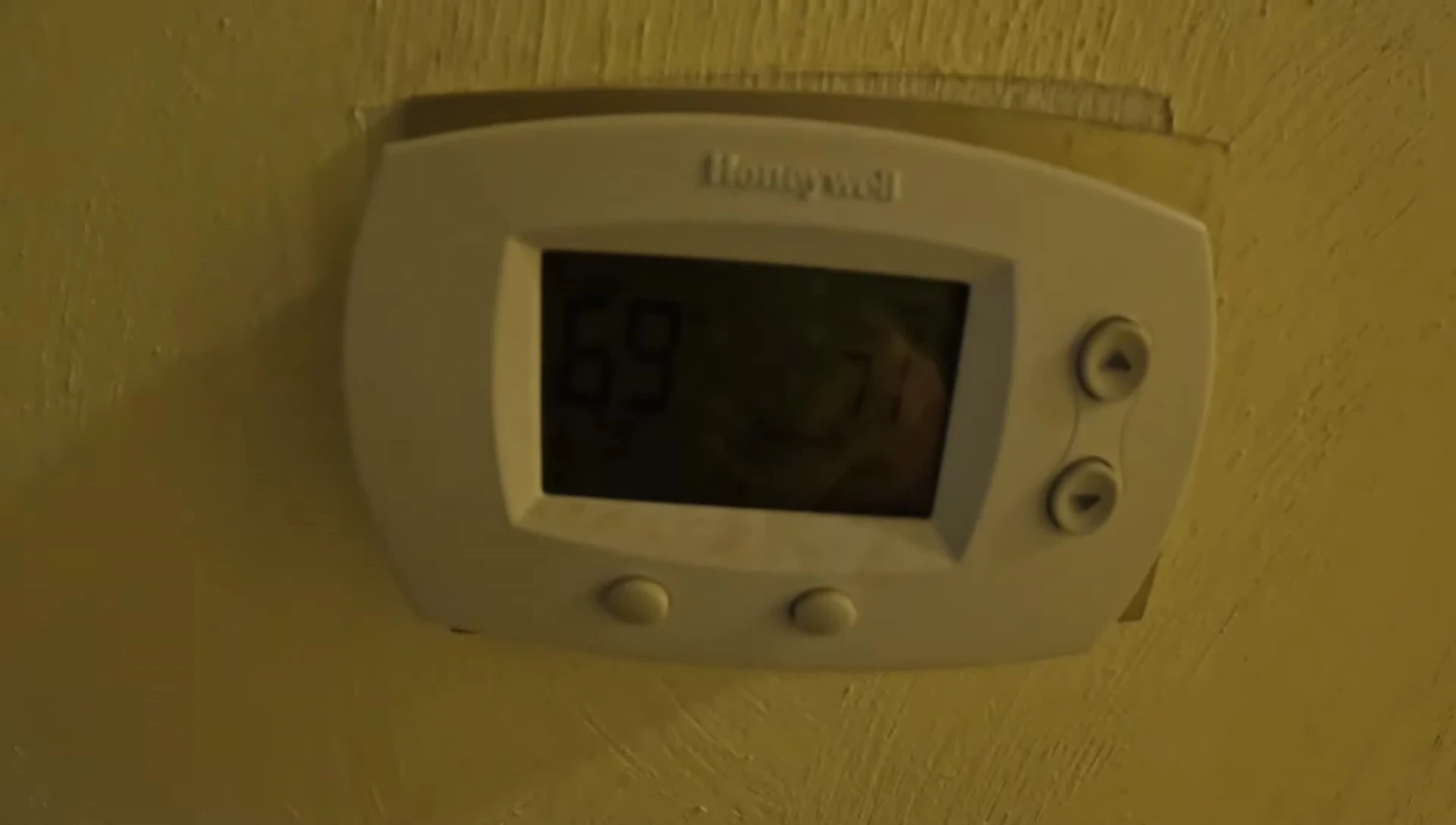 Removing the old Honeywell thermostat from the wall