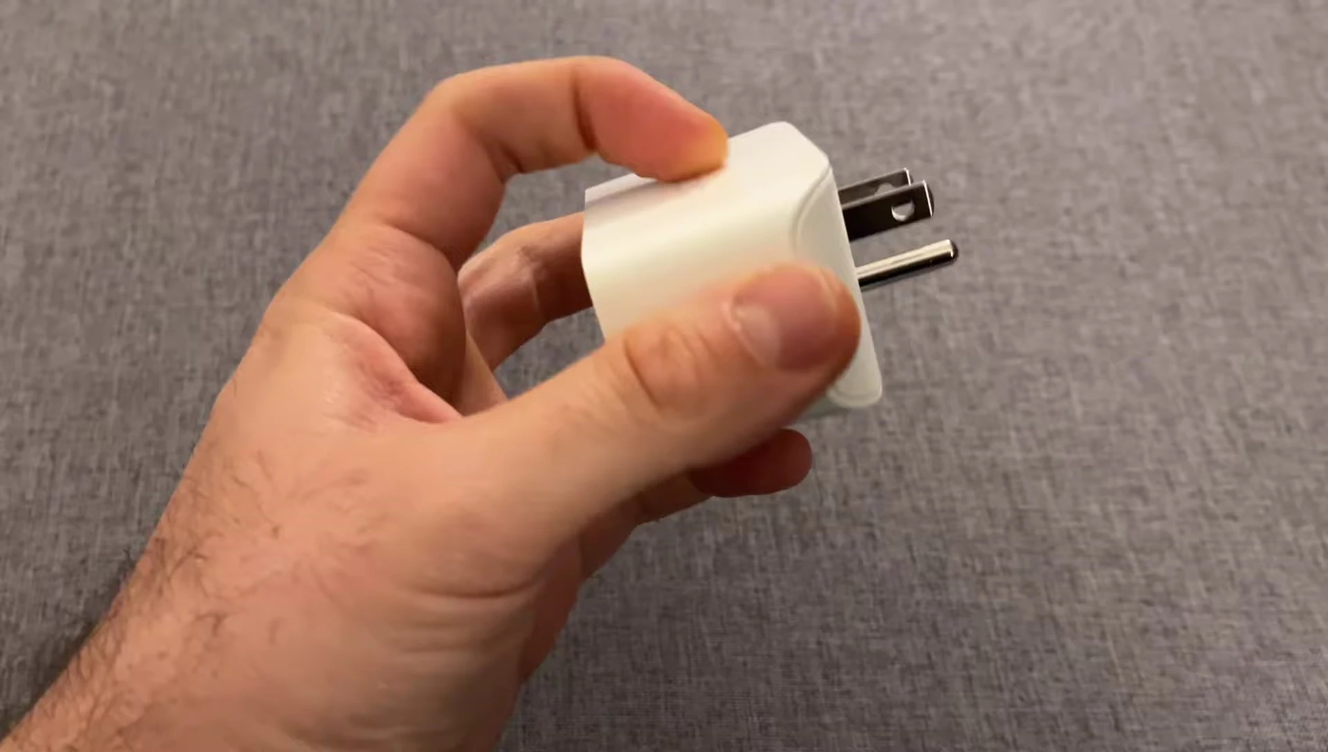 Smart plug plugged into a power strip, illustrating size limitations