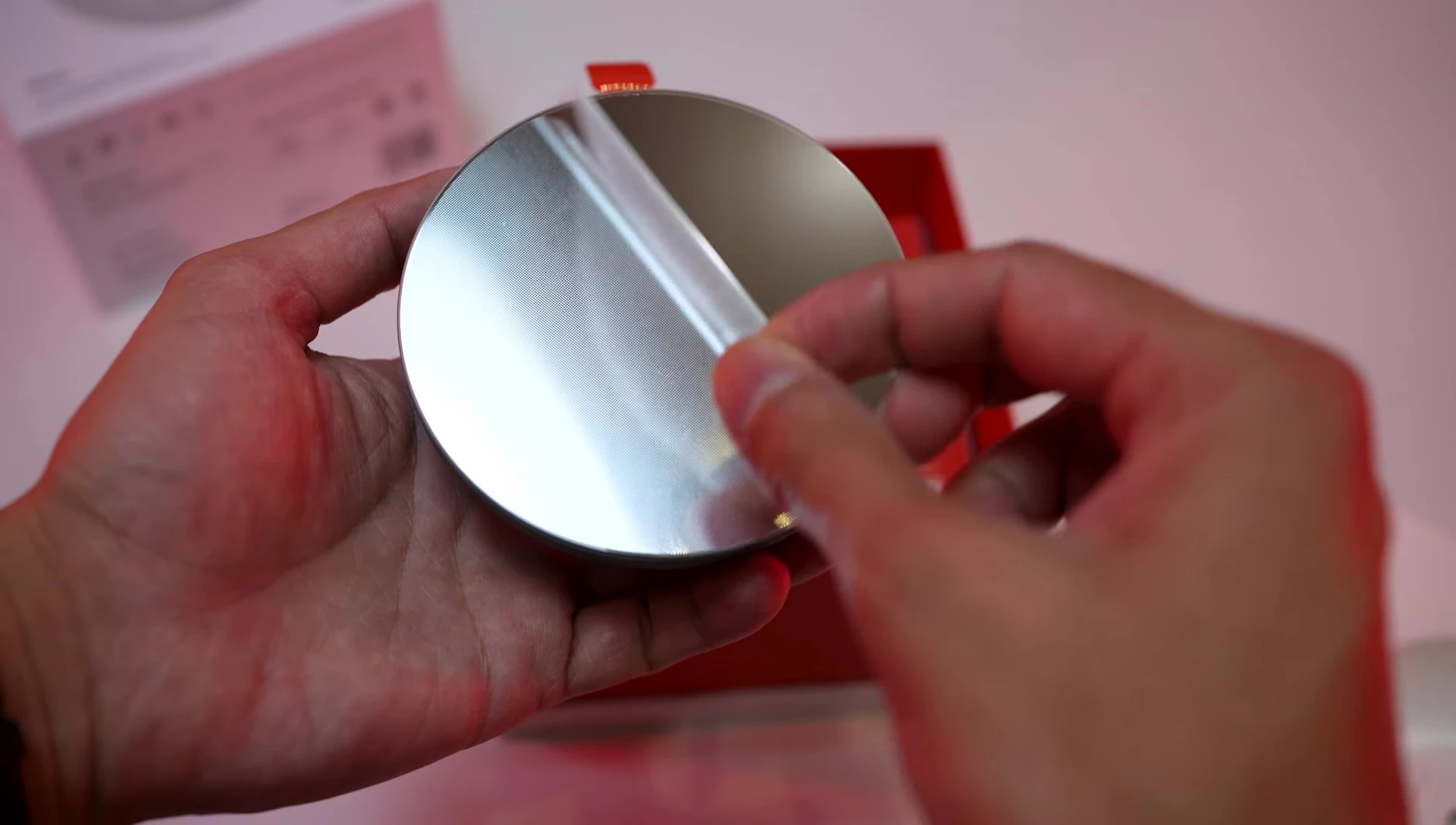 Close-up of the mirror-finished touchscreen device.