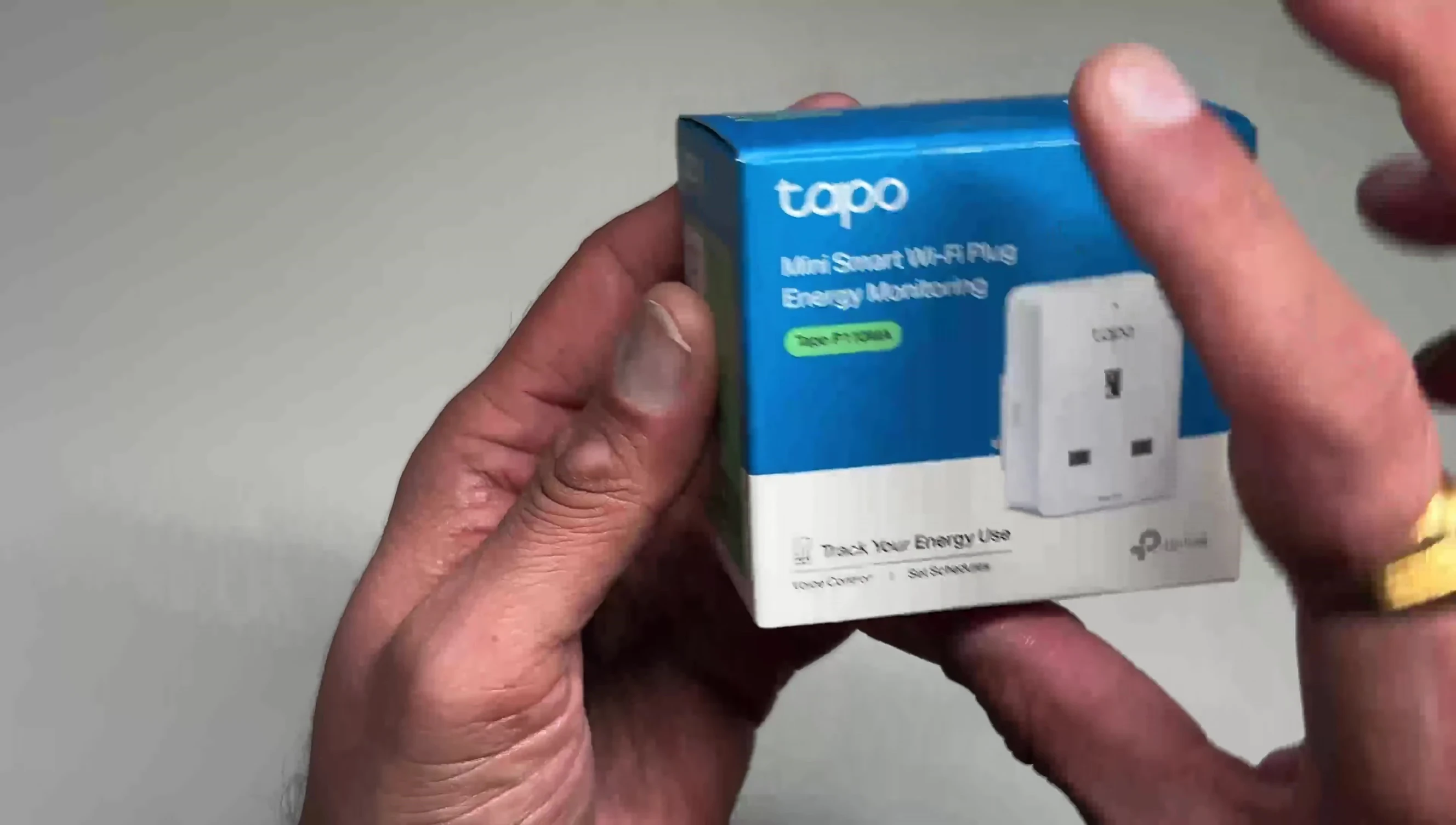 Close-up of the Tapo P110MA smart plug showing the Matter QR code