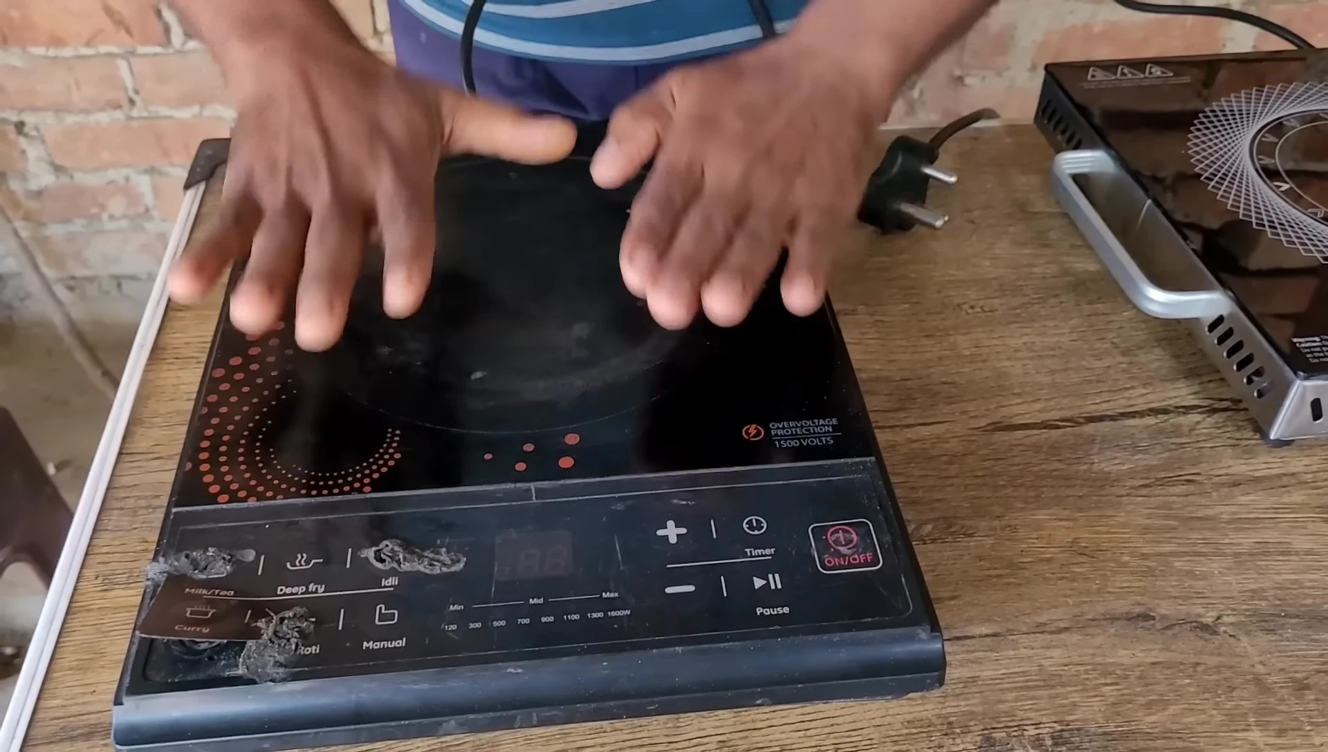 Usha induction cooktop shutting off after removing cookware