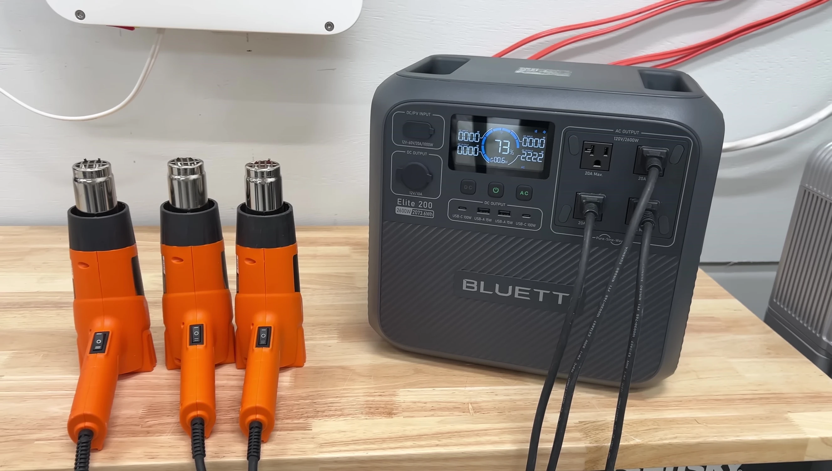 Close-up shot of the Bluetti Elite 200's display showing its power output during surge testing.