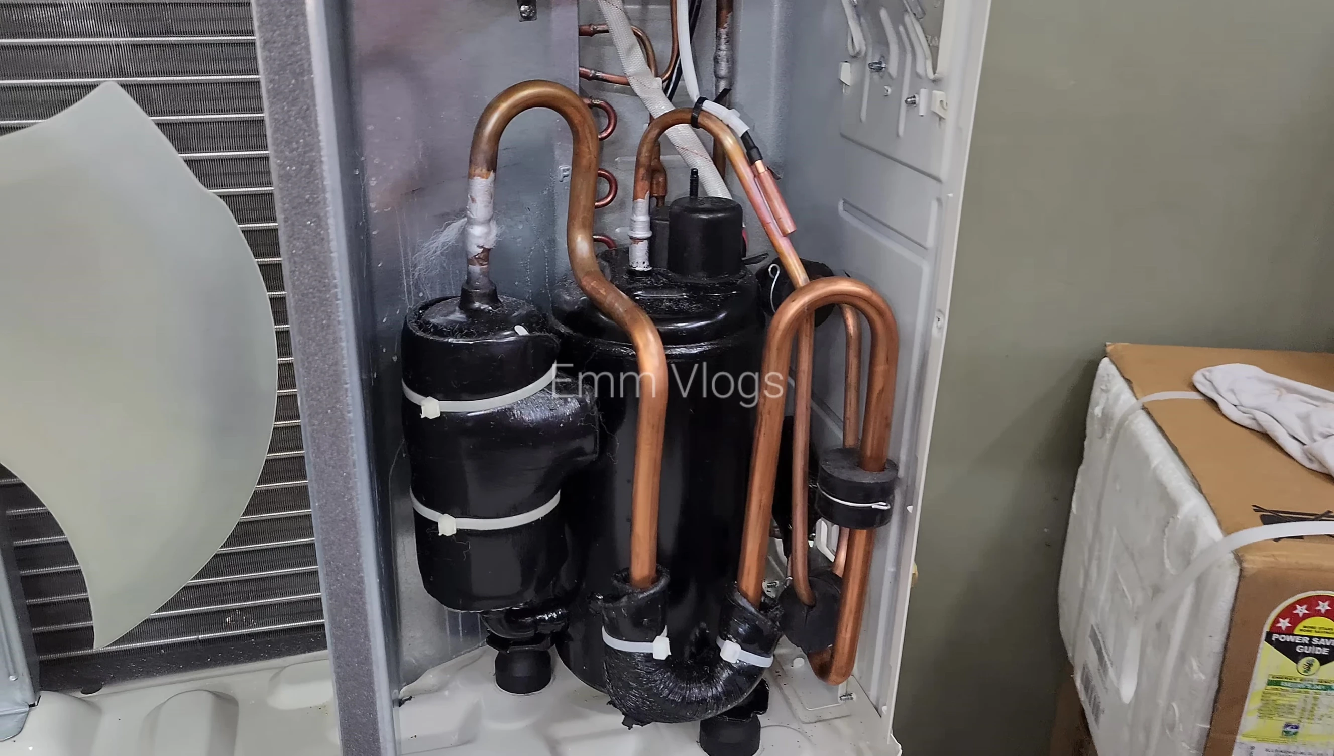 Comparison of the LG and Voltas AC compressors, highlighting the size difference