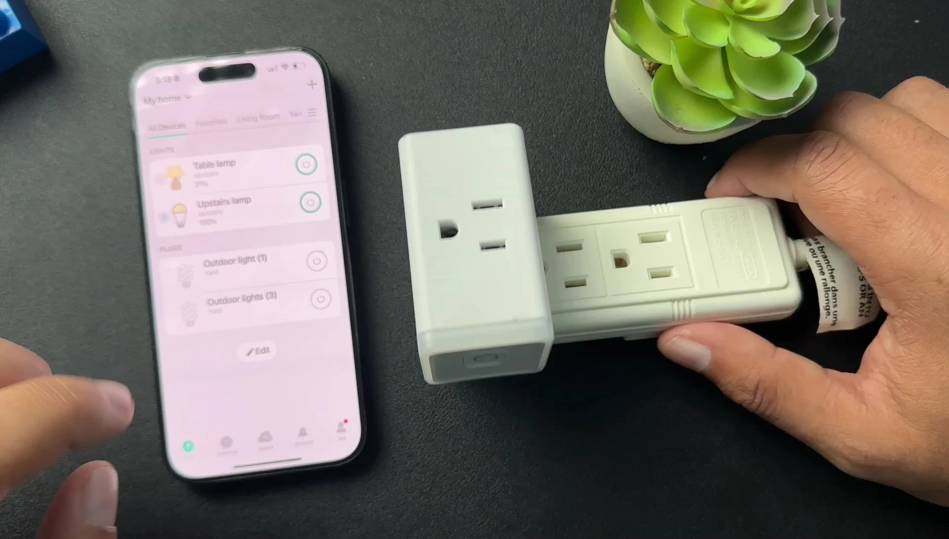 Close-up of the Kasa smart plug button