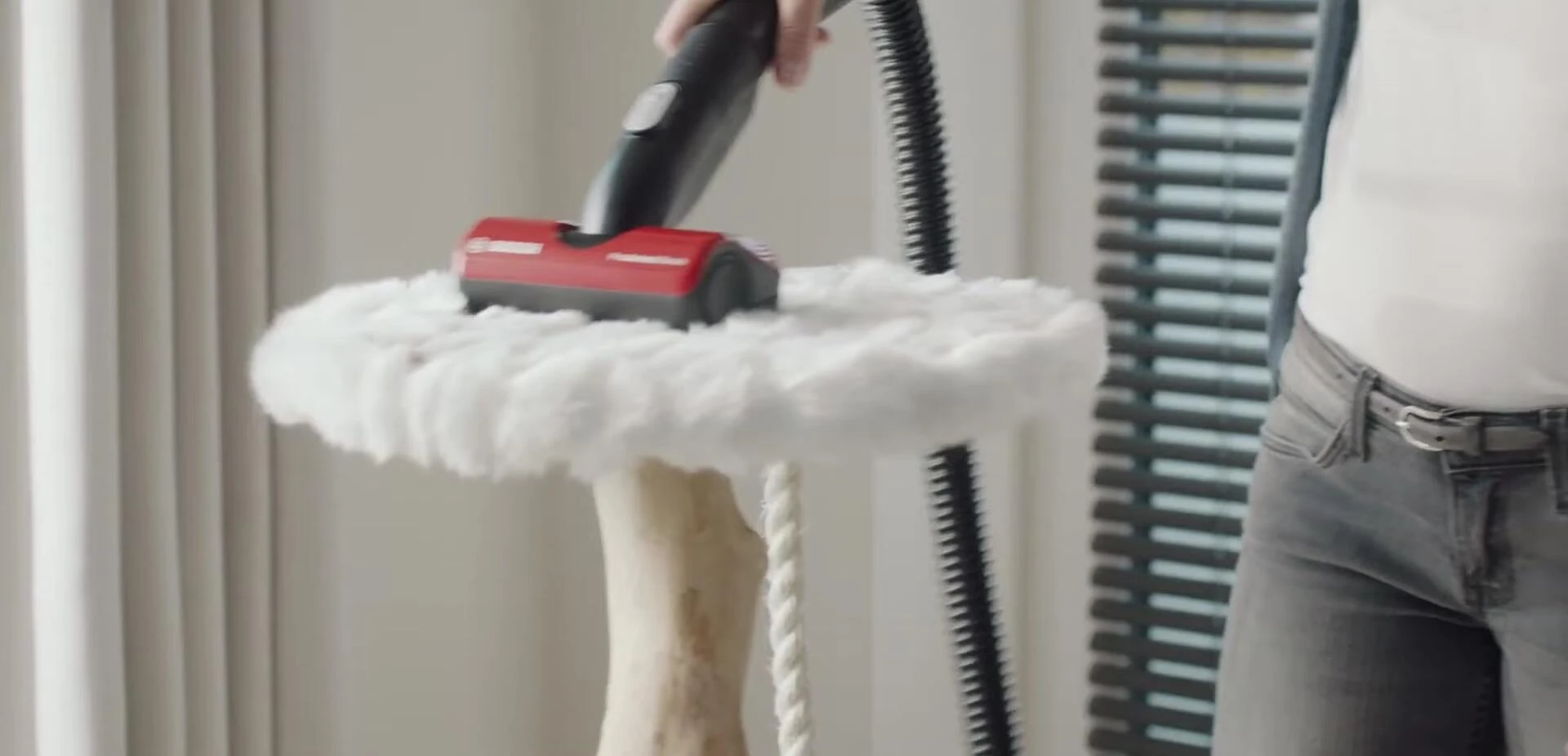 Image of a cordless vacuum with a flex tube.