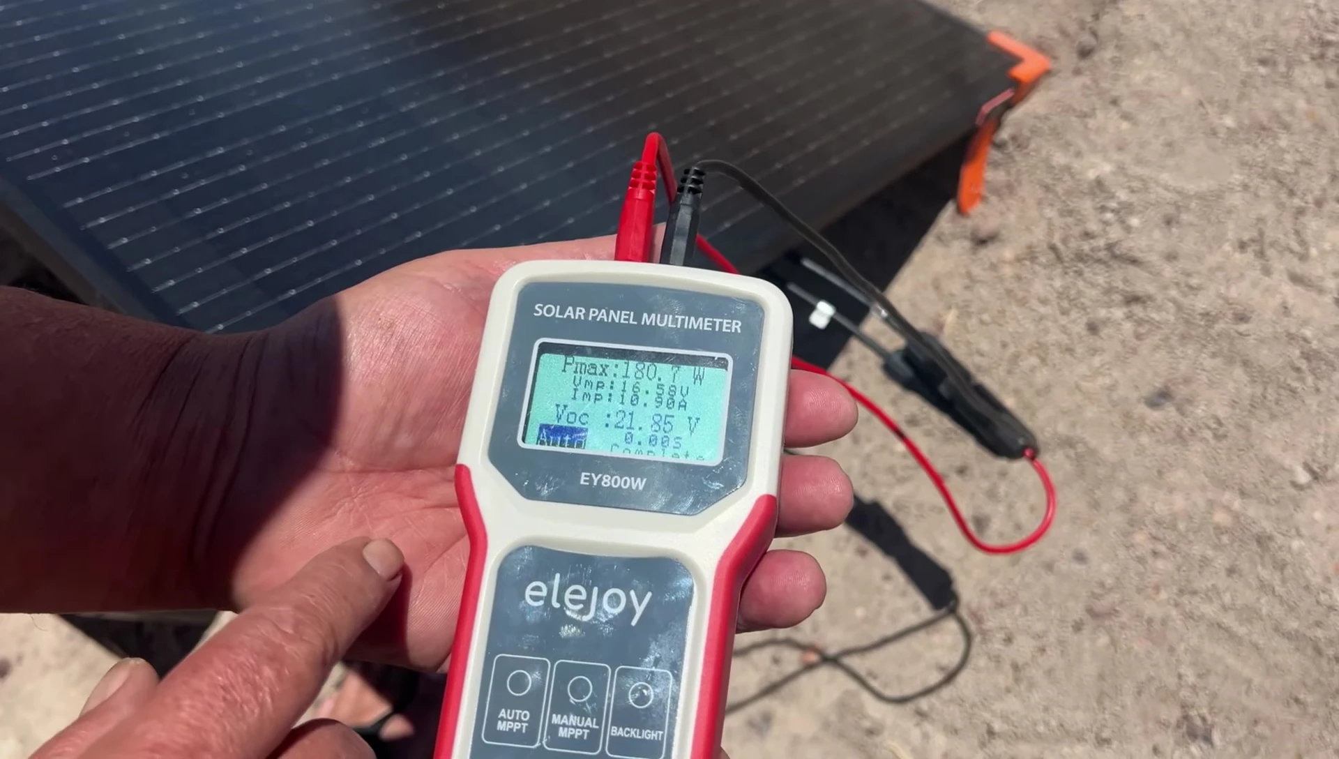 The ZoupW 200W solar panel connected to a solar panel tester, showing its wattage output.