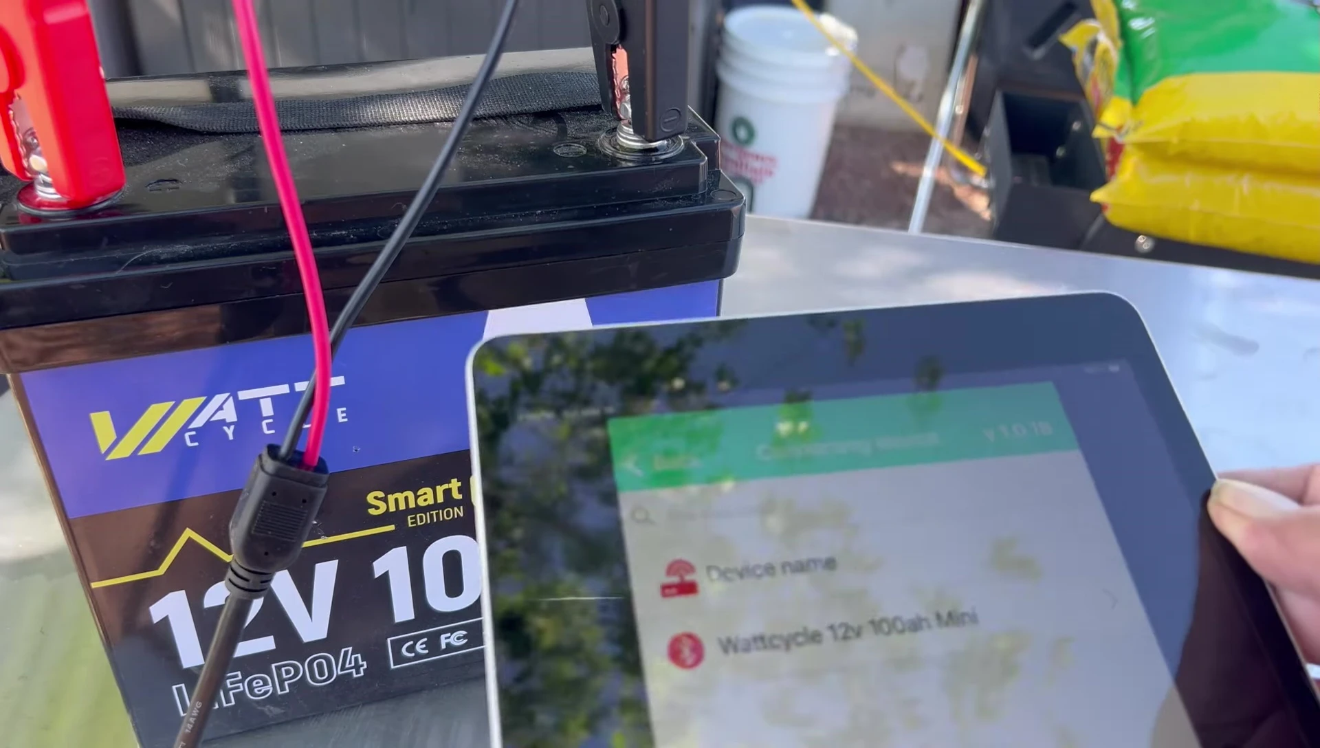 The PWM charge controller connected to the battery and tablet app.