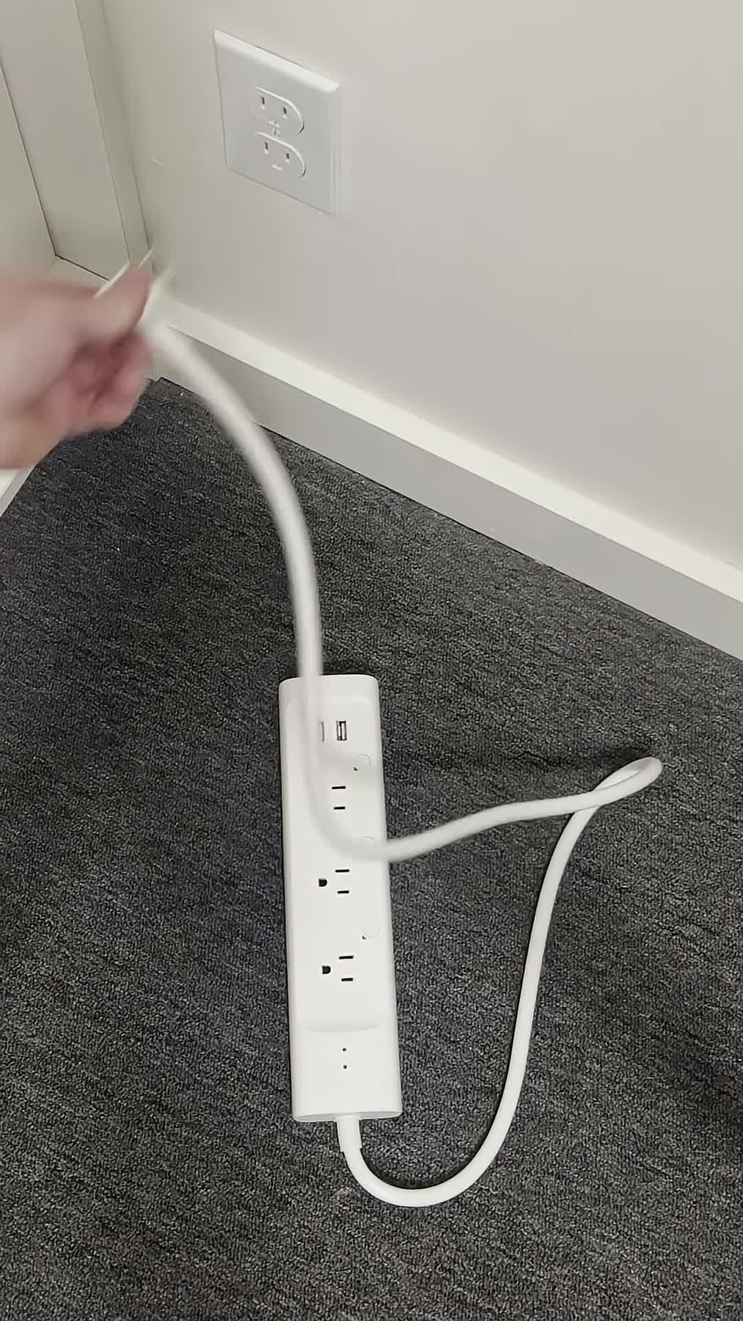 The TP-Link Kasa Smart Strip being plugged in